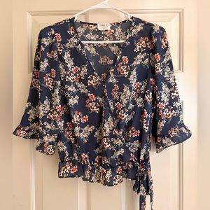 Sienna Sky brand top. Size X-Small. Blue floral satin feel fabric.